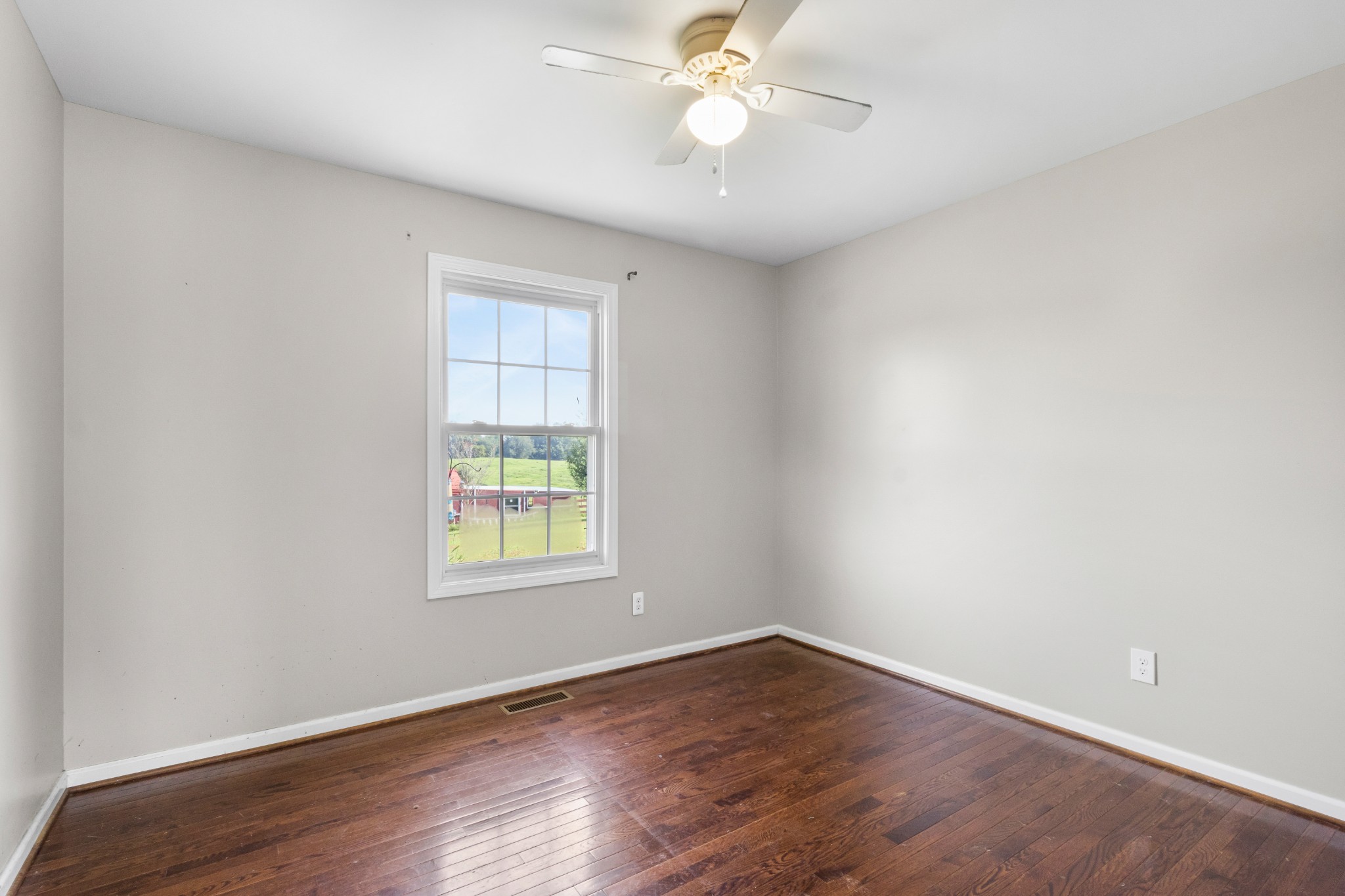 3382 Anderson Road Cedar Hill, TN 37032 - Photo 19 of 41 an empty room with wooden floor closet and windows