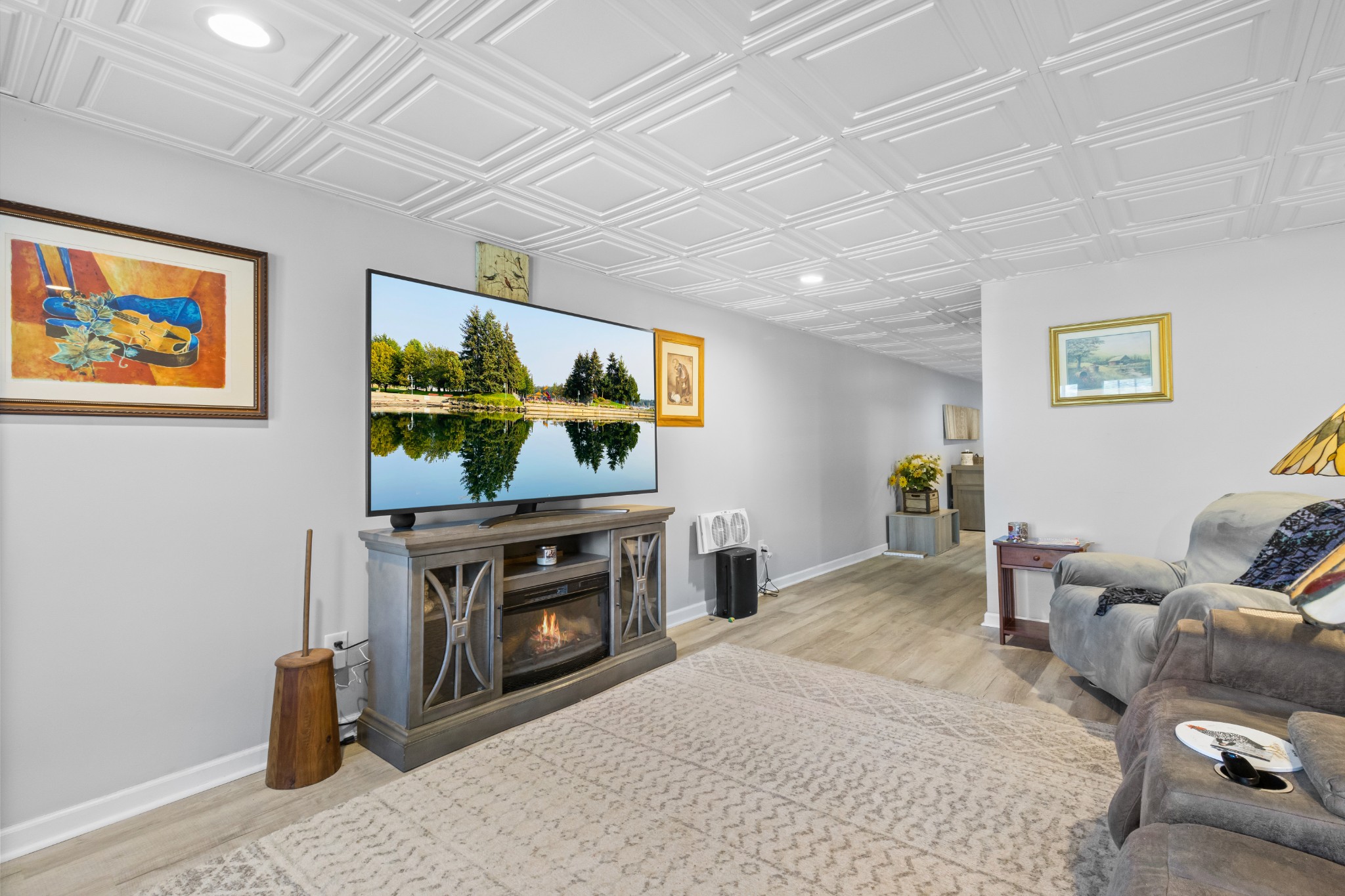 3382 Anderson Road Cedar Hill, TN 37032 - Photo 24 of 41 a living room with furniture a flat screen tv and a fireplace