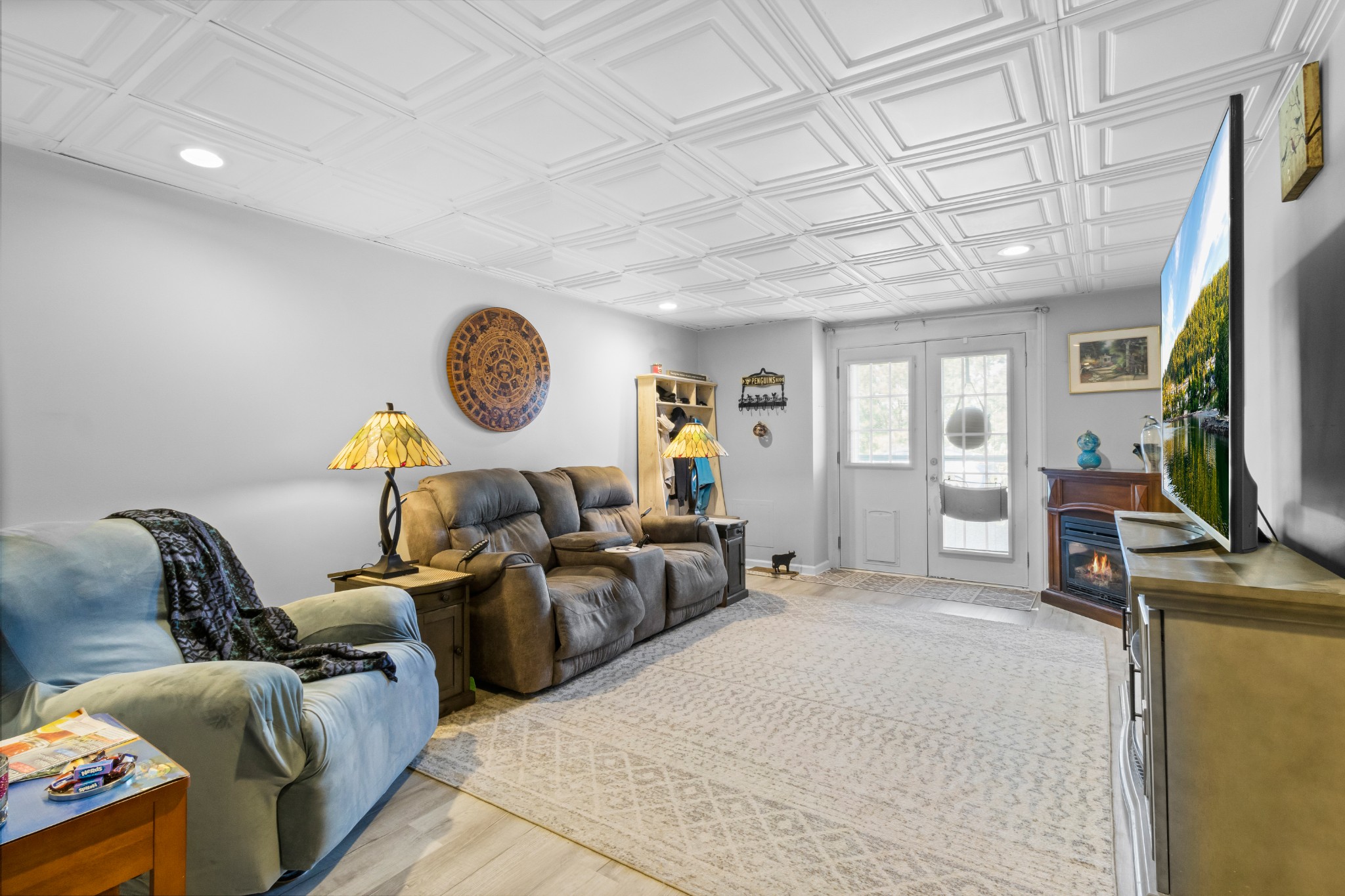 3382 Anderson Road Cedar Hill, TN 37032 - Photo 25 of 41 a living room with furniture a flat screen tv and a large window