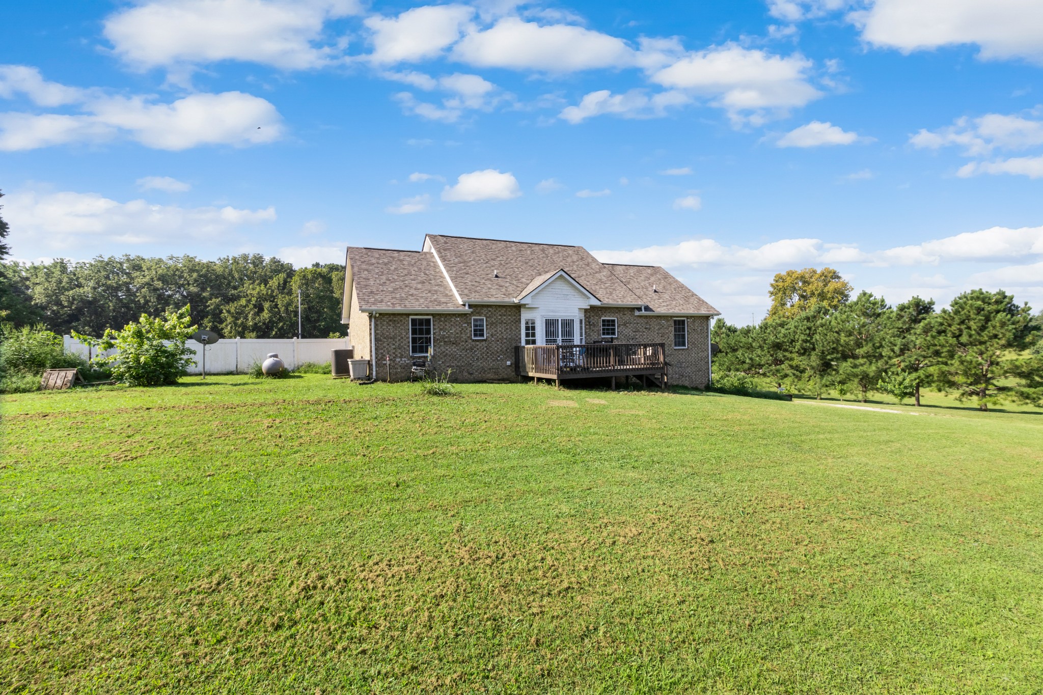 3382 Anderson Road Cedar Hill, TN 37032 - Photo 33 of 41 a front view of a house with a big yard