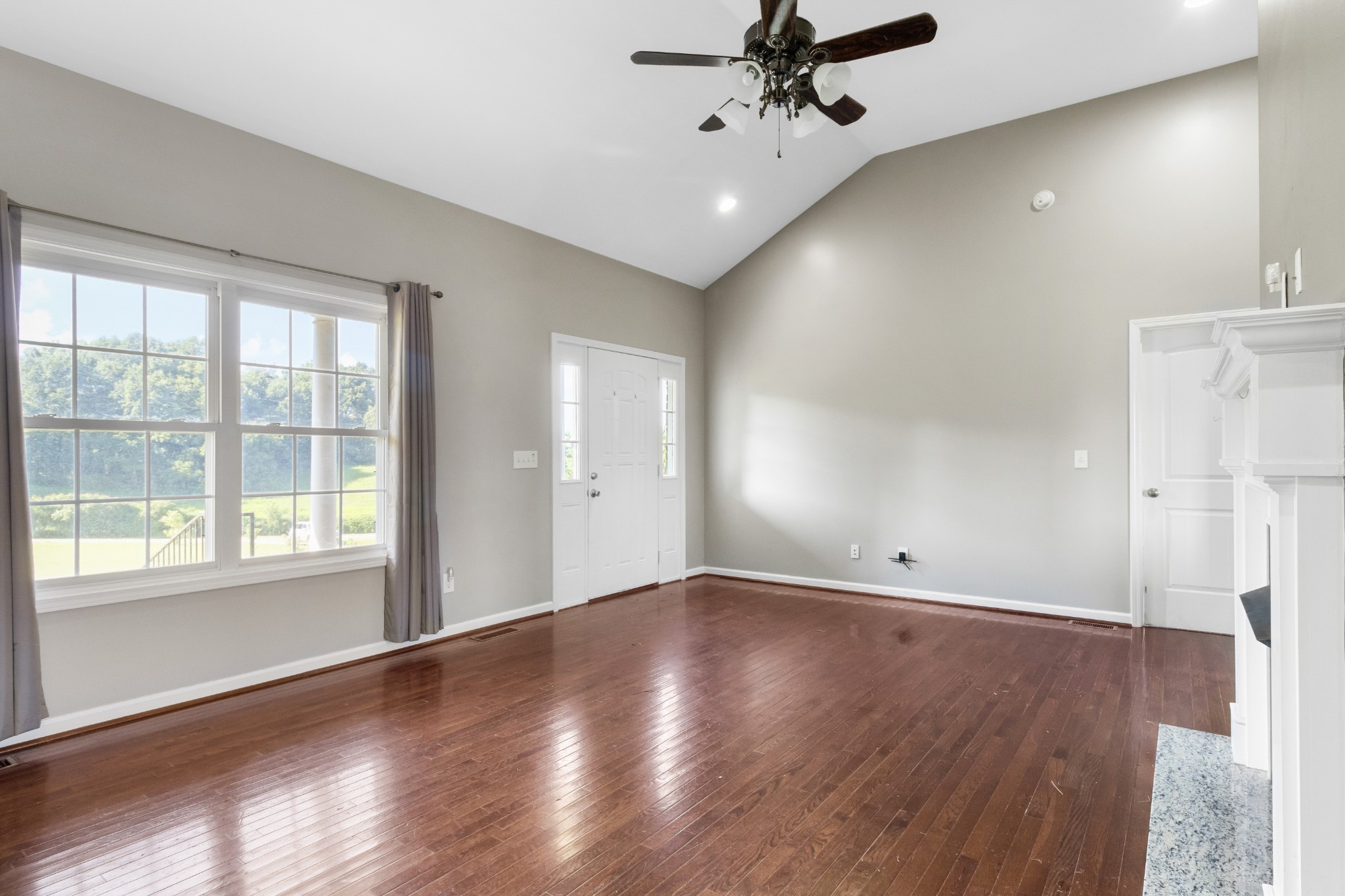 3382 Anderson Road Cedar Hill, TN 37032 - Photo 6 of 41 a view of an empty room with a window and wooden floor