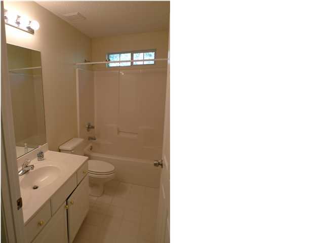 253 Walton Way Miramar Beach, FL 32550 - Photo 8 of 23 a bathroom with a sink a toilet and shower