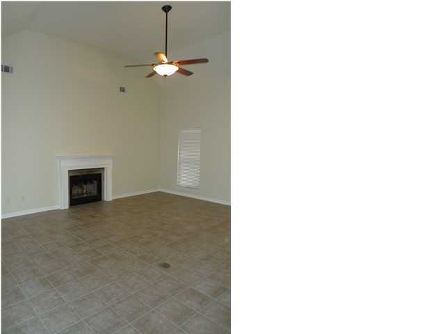 253 Walton Way Miramar Beach, FL 32550 - Photo 10 of 23 a view of a room with a ceiling fan and a rug