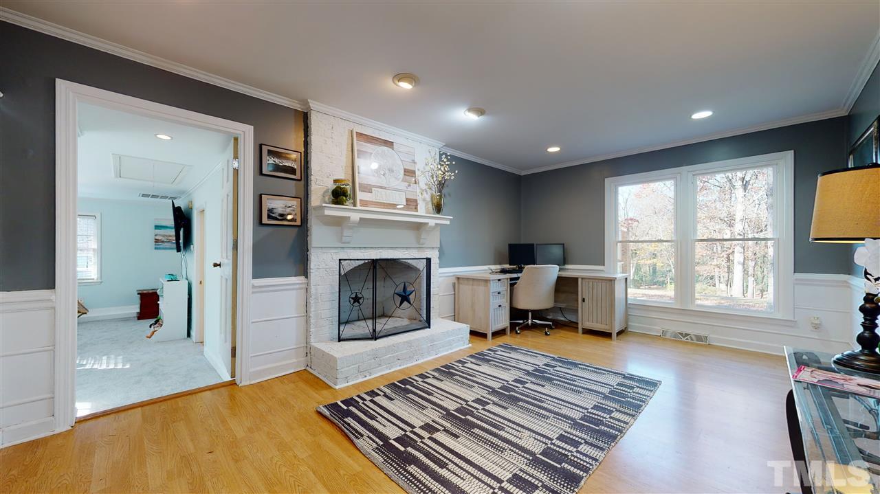 5904 Timber Ridge Drive Raleigh, NC 27609 - Photo 11 of 30 a living room with furniture and a fireplace