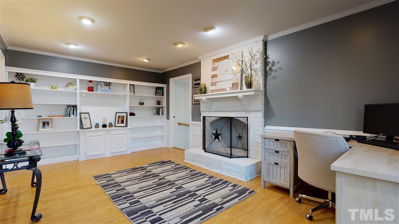5904 Timber Ridge Drive Raleigh, NC 27609 - Photo 12 of 30 a living room with furniture and a fireplace