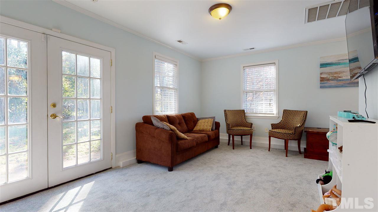 5904 Timber Ridge Drive Raleigh, NC 27609 - Photo 13 of 30 a living room with furniture and a window