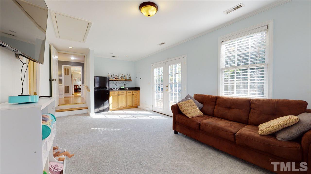 5904 Timber Ridge Drive Raleigh, NC 27609 - Photo 15 of 30 a living room with furniture and a window