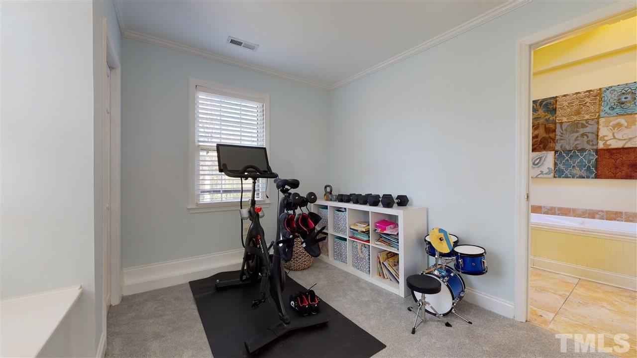 5904 Timber Ridge Drive Raleigh, NC 27609 - Photo 16 of 30 a view of a room with gym equipment