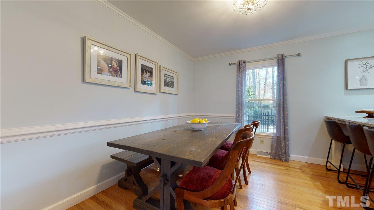 5904 Timber Ridge Drive Raleigh, NC 27609 - Photo 6 of 30 a view of a dining room with furniture and wooden floor