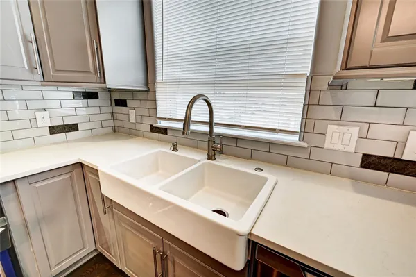 a kitchen with a refrigerator and a window