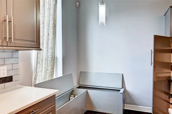 a kitchen with stainless steel appliances a refrigerator and cabinets