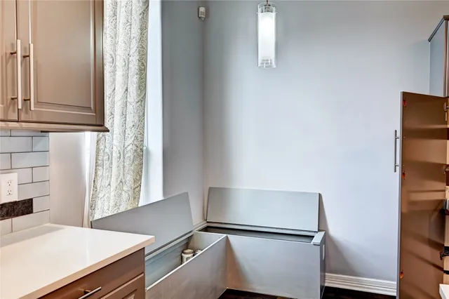 a kitchen with stainless steel appliances a refrigerator and cabinets