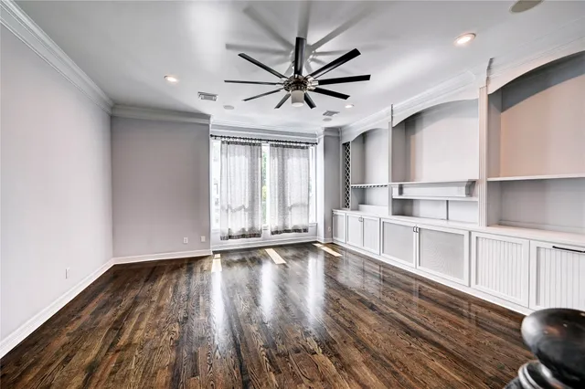 a view of a kitchen with wooden floor and window