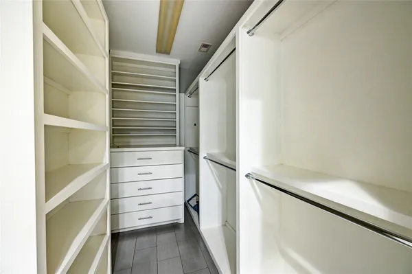 a bathroom with a granite countertop sink a mirror and vanity