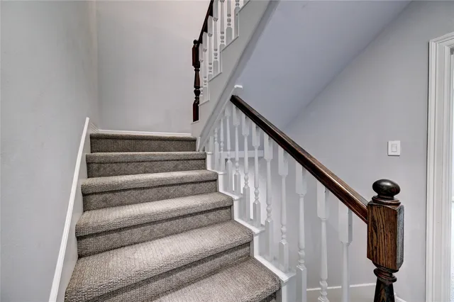 an empty room with a ceiling fan and bathroom