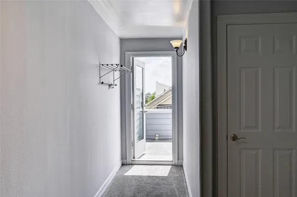 a view of building with roof and balcony
