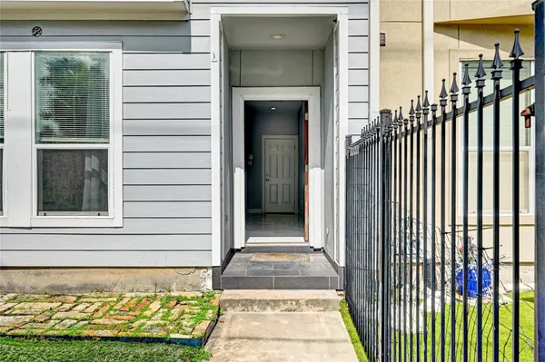 a view of a door of a house with a door and a rug