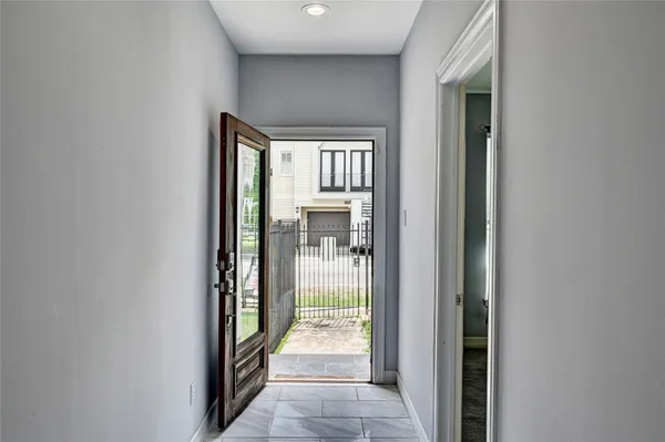 a view of a house with a backyard and a patio