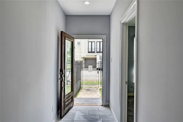 a view of a house with a backyard and a patio