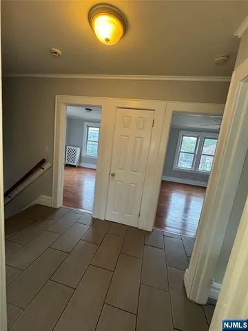 a view of entryway with kitchen