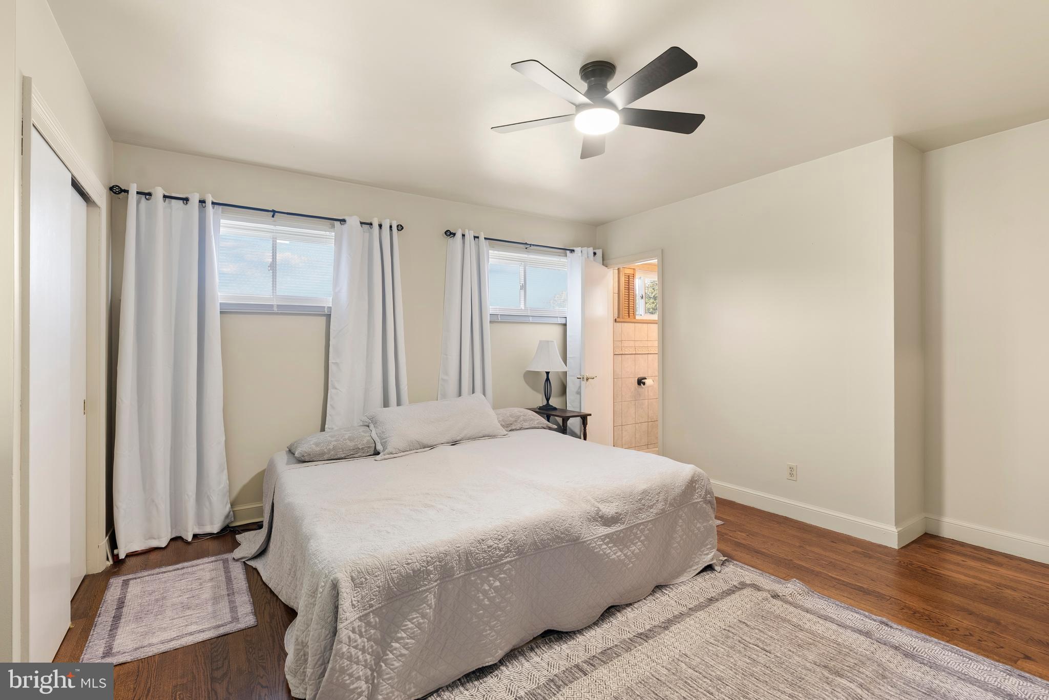 6605 Mt Vista Road Kingsville, MD 21087 - Photo 23 of 54 a bedroom with a large bed and a chandelier