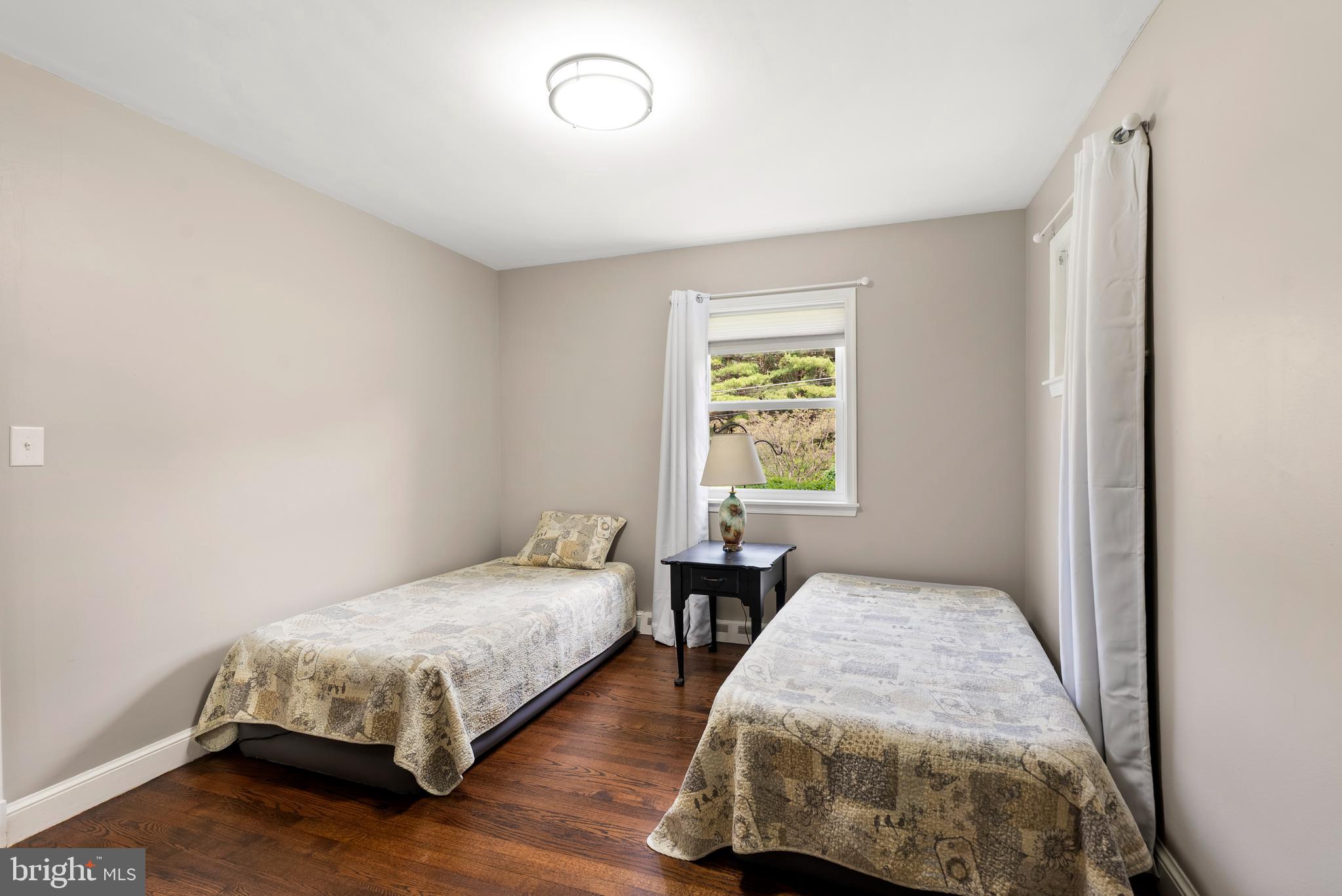 6605 Mt Vista Road Kingsville, MD 21087 - Photo 33 of 54 a bedroom with two beds and a window
