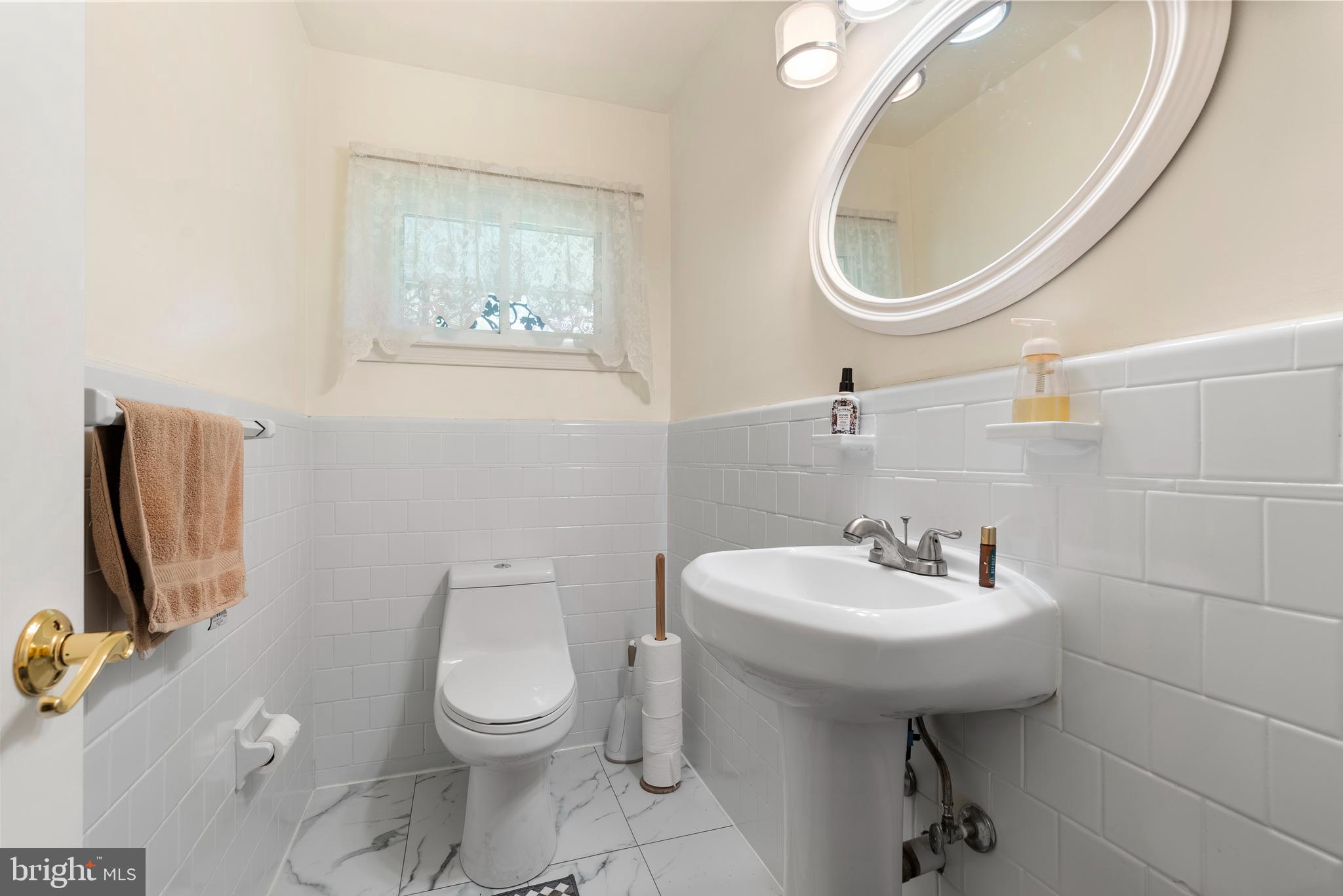 6605 Mt Vista Road Kingsville, MD 21087 - Photo 35 of 54 a bathroom with a toilet a sink and mirror