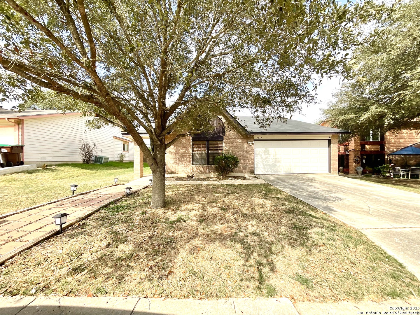 9919 Fortune Ridge Drive Converse, TX 78109 - Photo 1 of 34 a view of a yard with a large tree