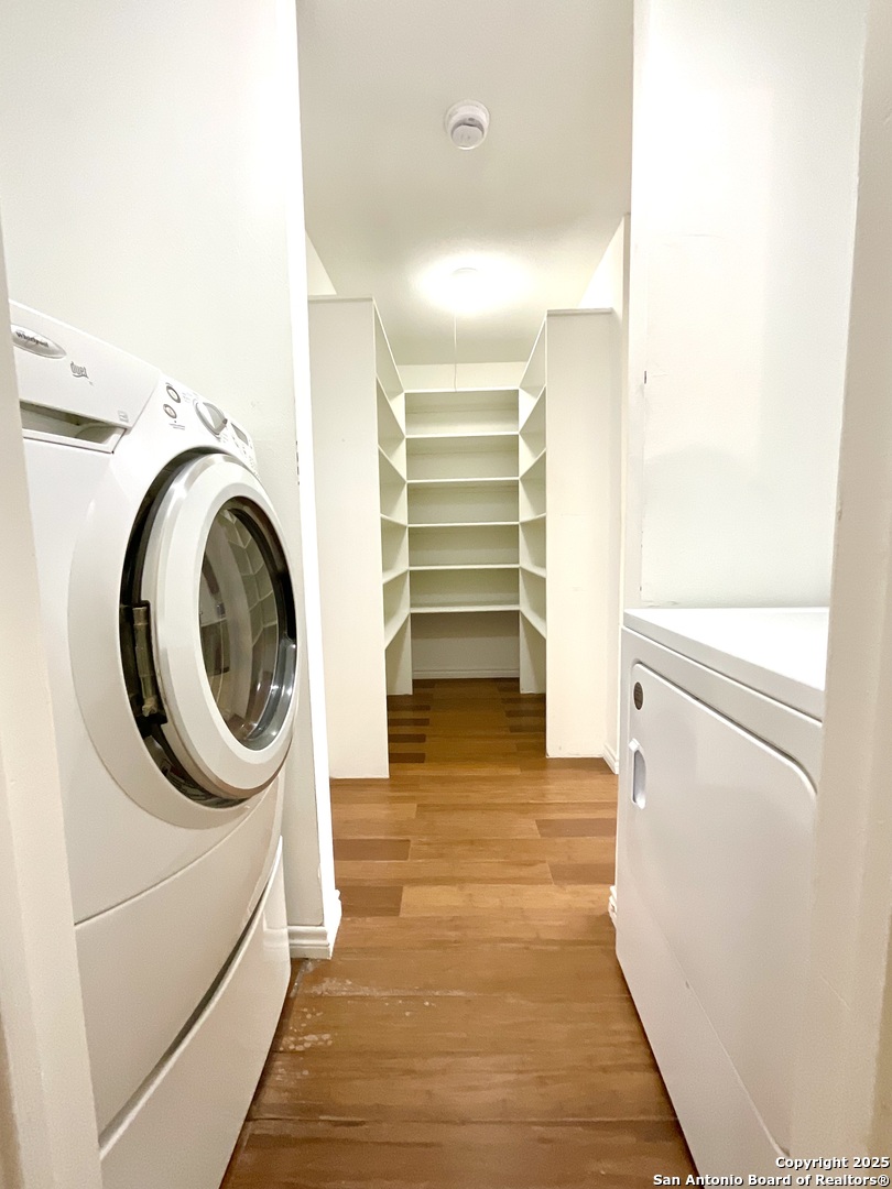 9919 Fortune Ridge Drive Converse, TX 78109 - Photo 15 of 34 a bathroom with a sink and a washer