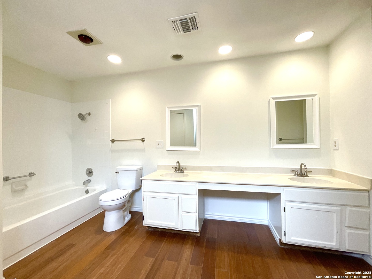9919 Fortune Ridge Drive Converse, TX 78109 - Photo 26 of 34 a bathroom with a double vanity sink a toilet and a bathtub