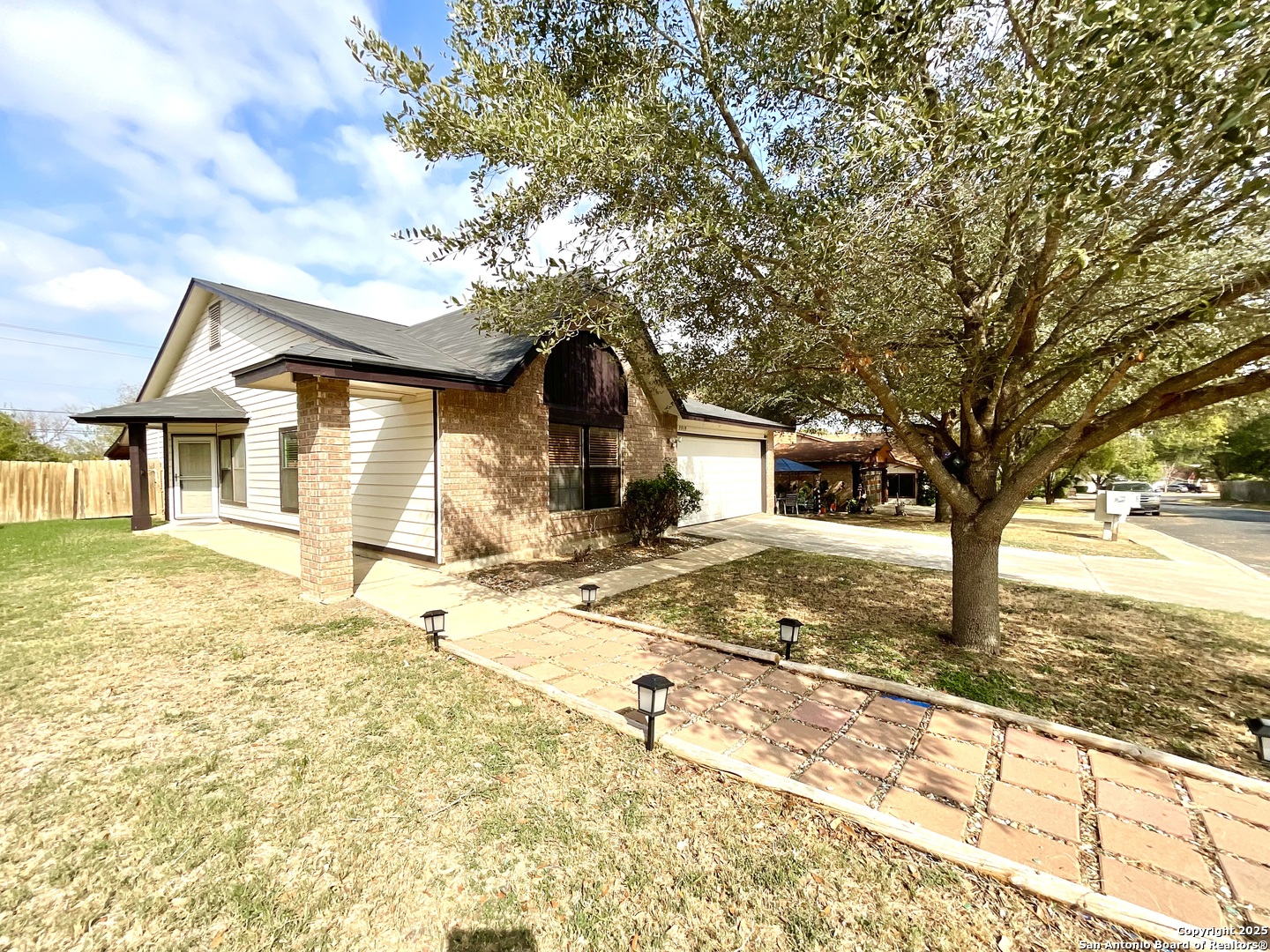9919 Fortune Ridge Drive Converse, TX 78109 - Photo 3 of 34 a front view of a house with a yard