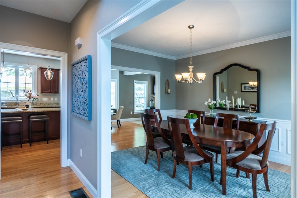 493 Taylor Road Stow, MA 01775 - Photo 12 of 40 a view of a dining room with furniture and wooden floor