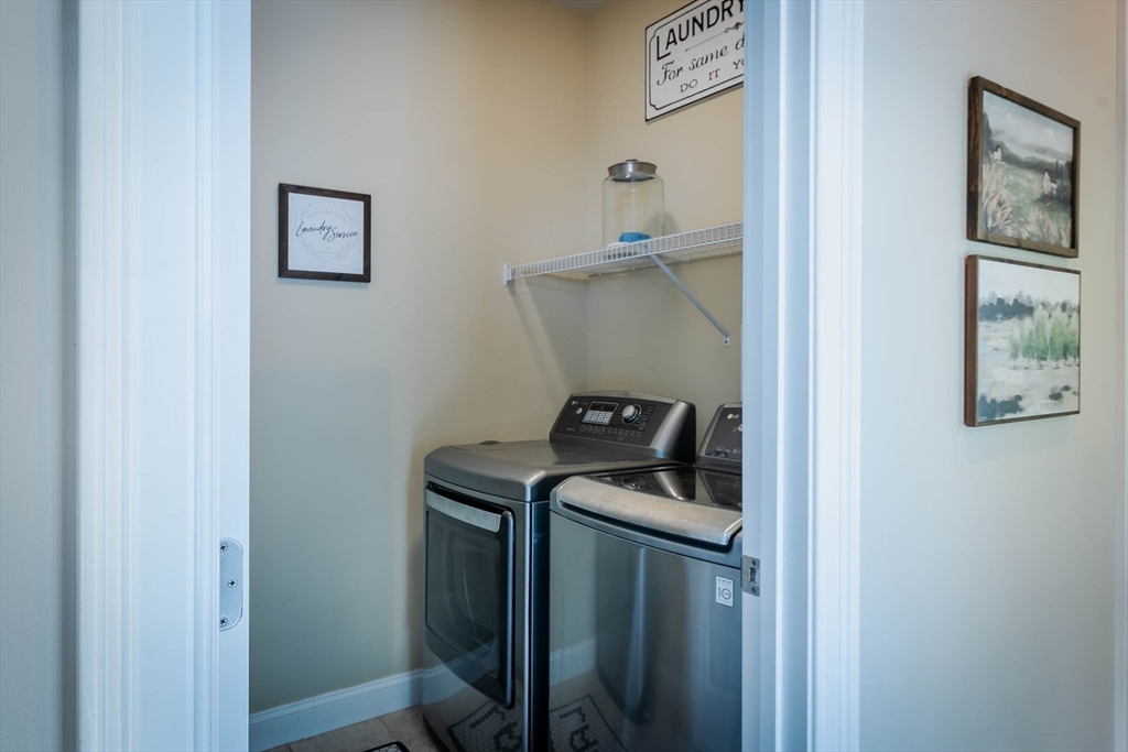 493 Taylor Road Stow, MA 01775 - Photo 25 of 40 a utility room with dryer and washer