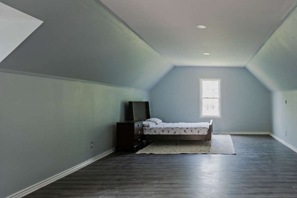 493 Taylor Road Stow, MA 01775 - Photo 37 of 40 a bedroom with a bed and window