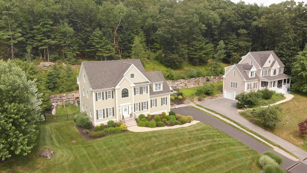 493 Taylor Road Stow, MA 01775 - Photo 38 of 40 a front view of a house with a yard