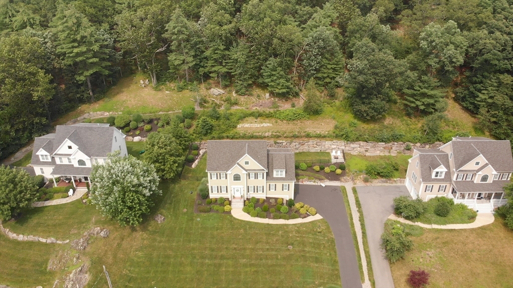 493 Taylor Road Stow, MA 01775 - Photo 39 of 40 a view of a lake with a house in the background