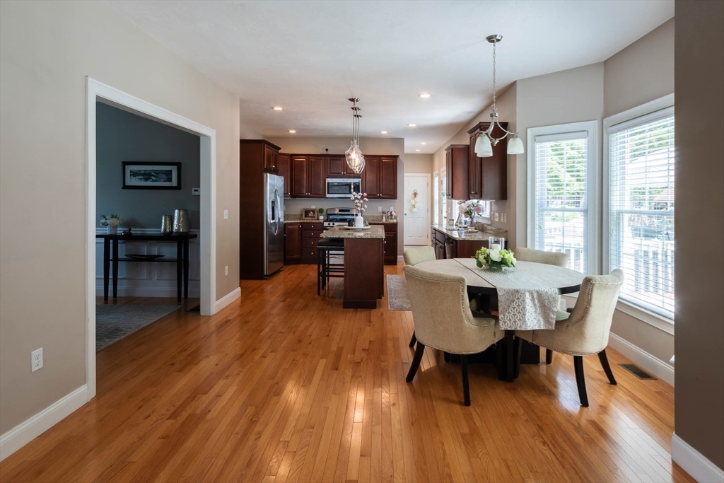 493 Taylor Road Stow, MA 01775 - Photo 7 of 40 a dining room with furniture and wooden floor