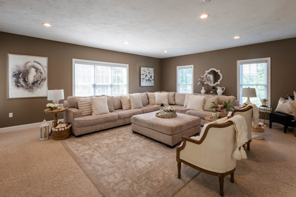 493 Taylor Road Stow, MA 01775 - Photo 9 of 40 a living room with furniture and a window
