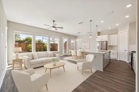 a very nice looking living room with a large window