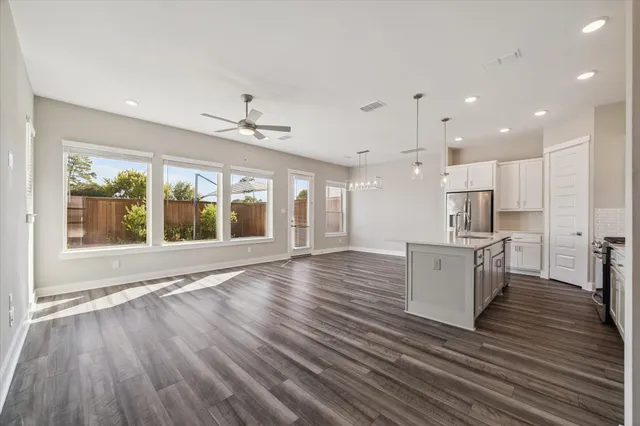 a view of kitchen with cabinets and wooden floor