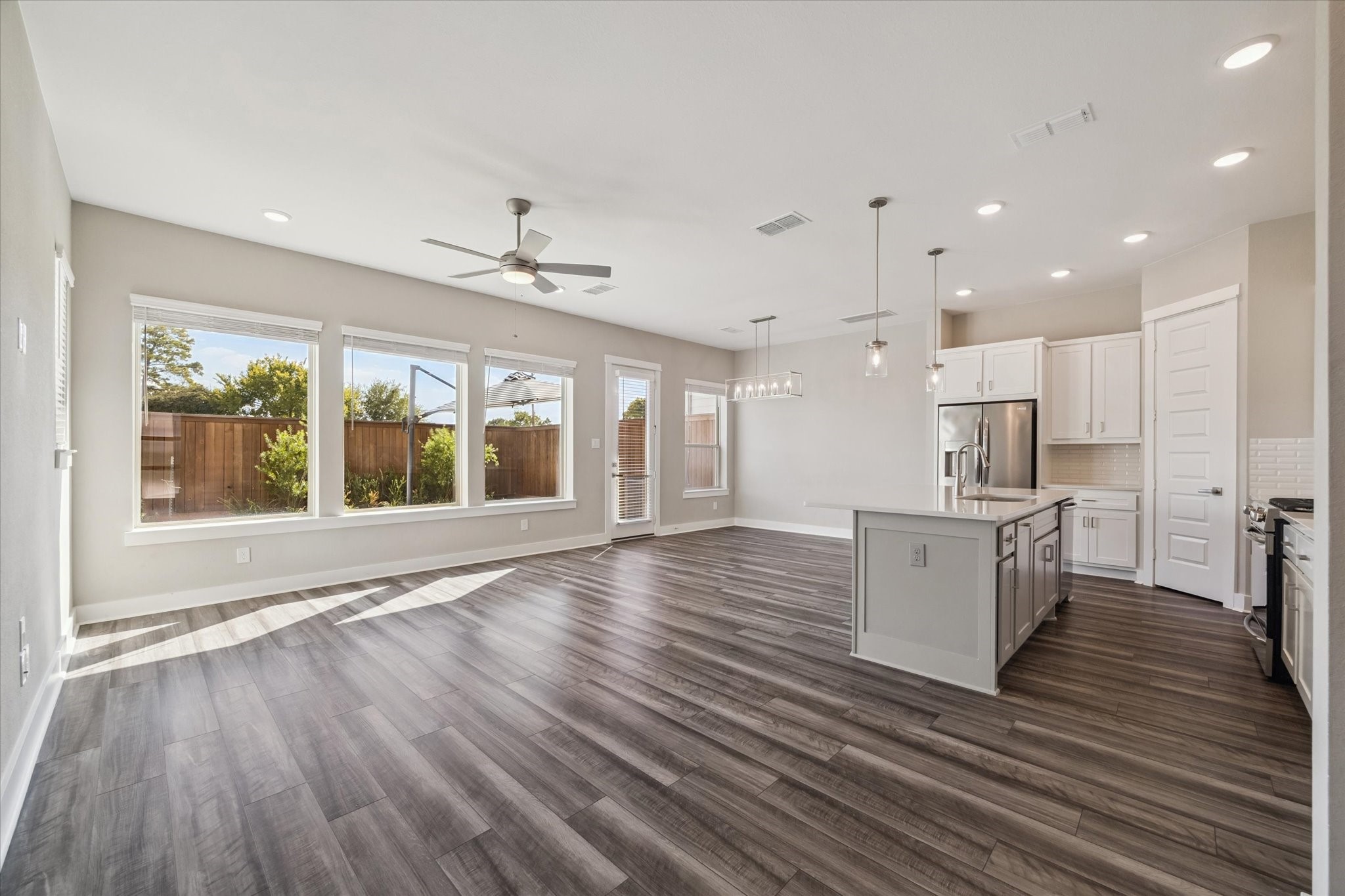 10961 Hewitt Cliff Lane Houston, TX 77043 - Photo 2 of 26 a view of kitchen with cabinets and wooden floor
