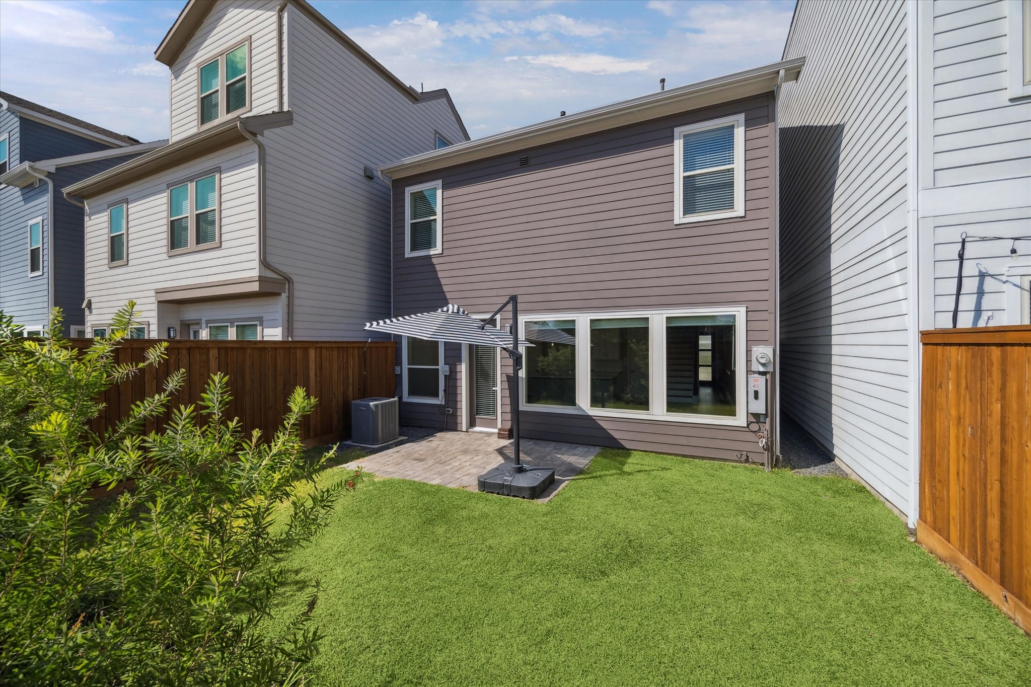 10961 Hewitt Cliff Lane Houston, TX 77043 - Photo 22 of 26 a house view with a garden space