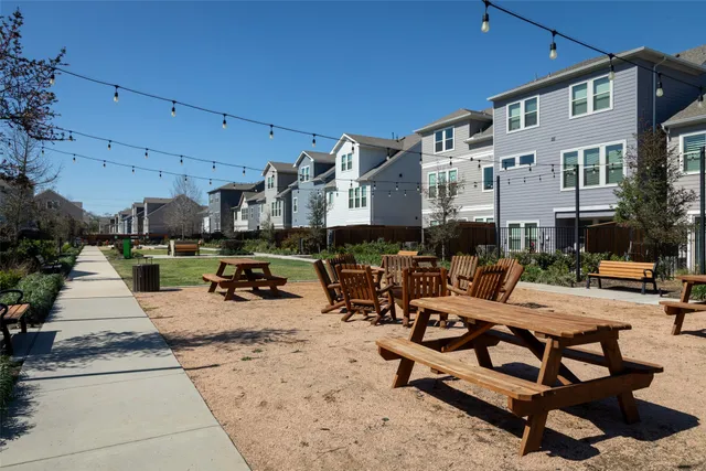 a view of a backyard with sitting area