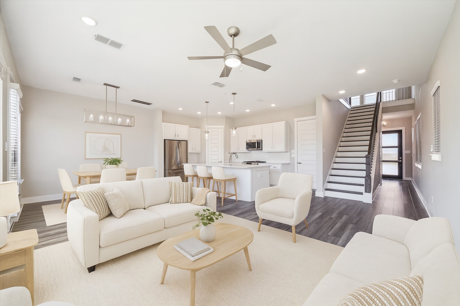 10961 Hewitt Cliff Lane Houston, TX 77043 - Photo 4 of 26 a living room with furniture and a view of kitchen