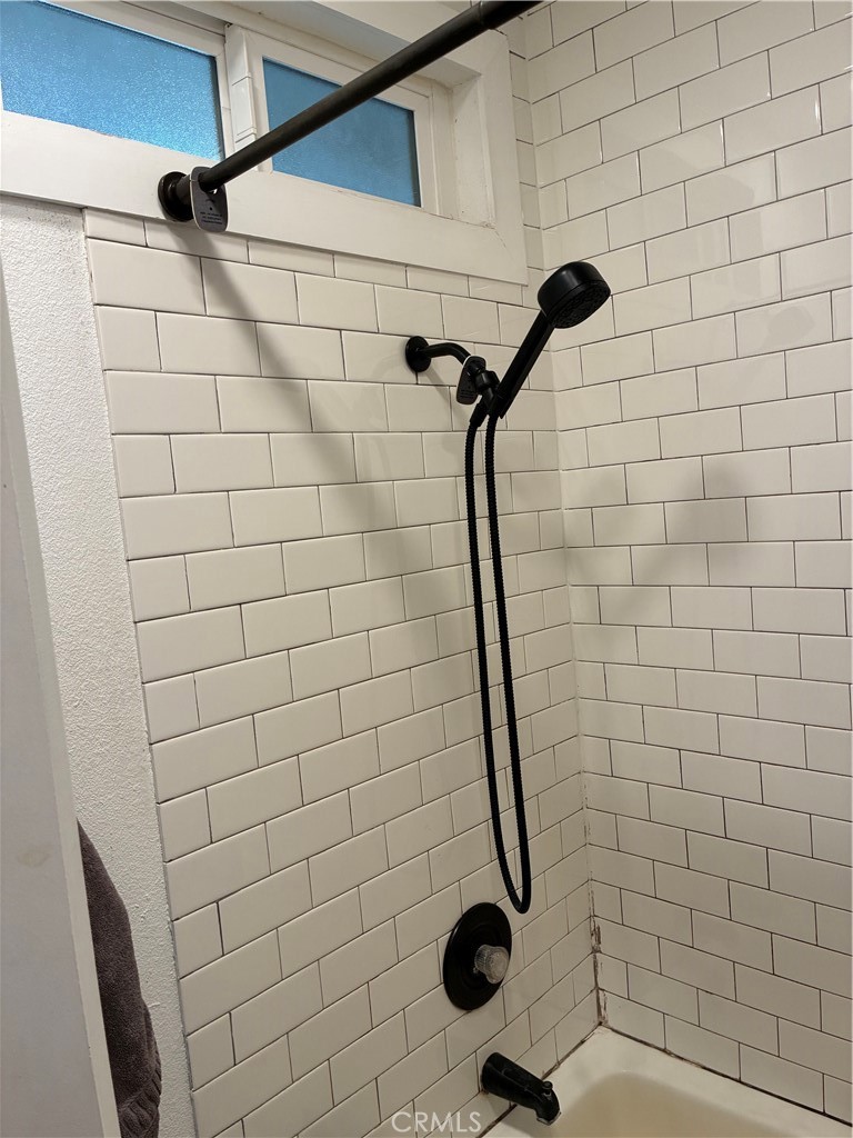 8990 19th Street, Unit 329 Rancho Cucamonga, CA 91701 - Photo 3 of 13 a bathroom with a shower