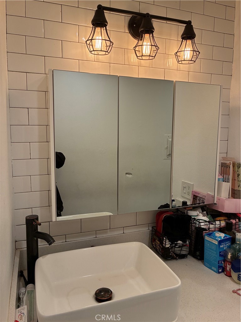 8990 19th Street, Unit 329 Rancho Cucamonga, CA 91701 - Photo 6 of 13 a bathroom with a tub and a sink