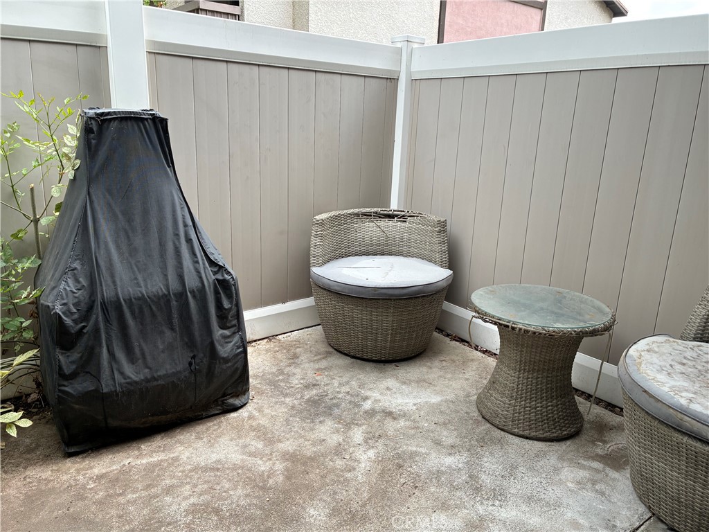 8990 19th Street, Unit 329 Rancho Cucamonga, CA 91701 - Photo 9 of 13 a view of a room with a hanging chair and a grill