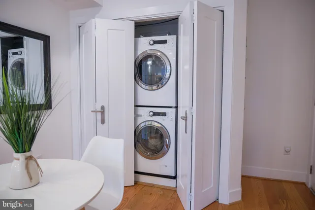 a utility room with sink dryer and washer