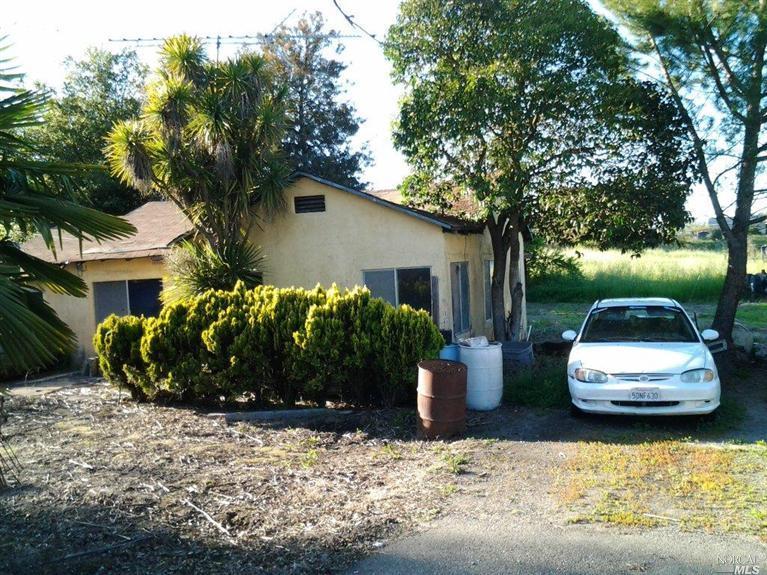 2275 Silk Road Windsor, CA 95492 - Photo 1 of 1 a front view of a house with a garden and plants