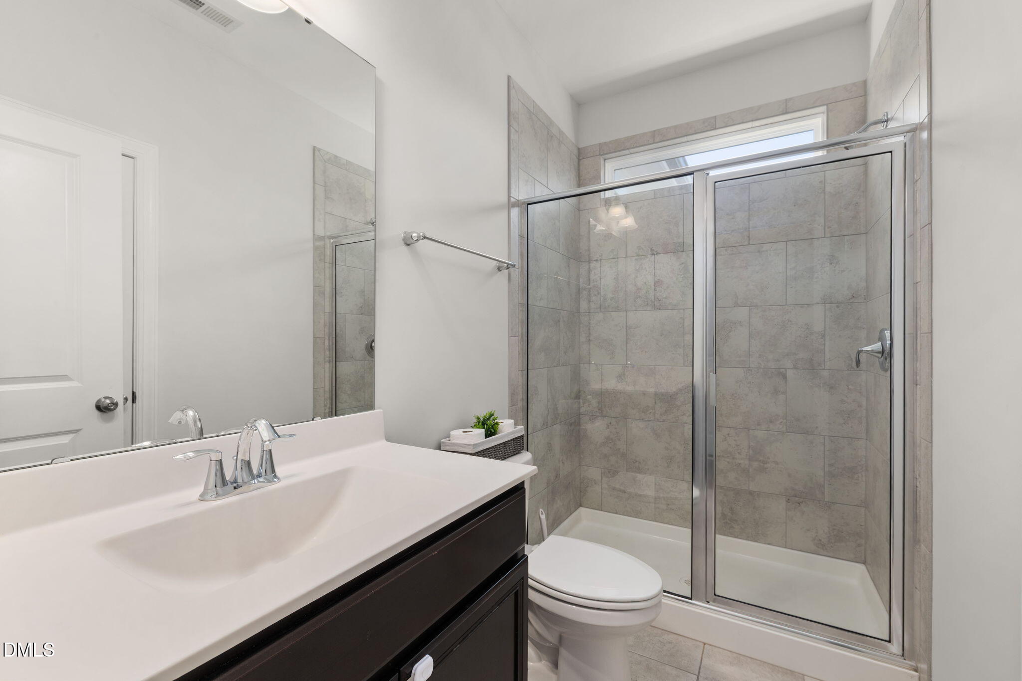3422 Longleaf Estates Drive Raleigh, NC 27616 - Photo 25 of 71 a bathroom with a sink and a mirror